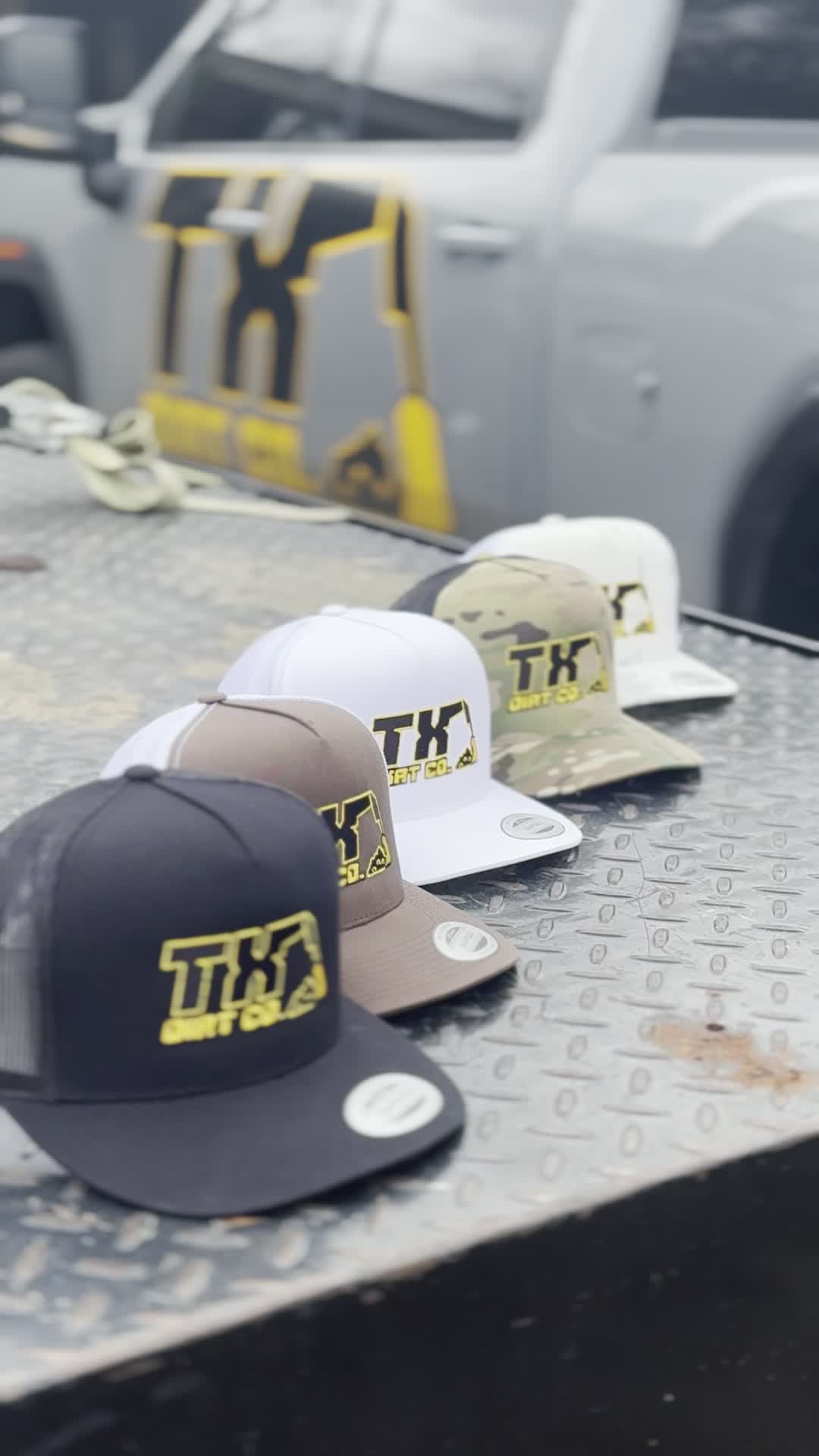 TX Dirt Co. hats on diamond plate